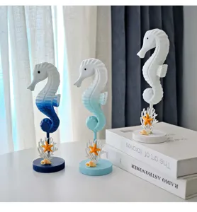Marine style seahorse ornament detail showing resin coastal decor with starfish base on desk.