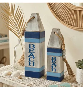 Coastal wooden buoy decor set with BEACH lettering and rope accent for beach themed home decor.