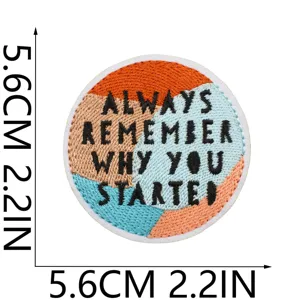 Vue détaillée d'un patch brodé rond motivant avec un design de citation inspirante.