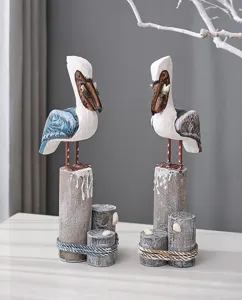 Handcrafted wooden pelican sculpture set coastal table decor rustic animal home figurine art.