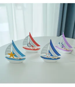 Close-up detail of Mediterranean miniature wooden sailboat model showcasing nautical decor.
