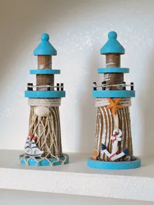 Wooden lighthouse decor detail, Mediterranean style desktop ornament with anchor and shell.