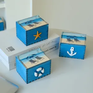 Mediterranean wooden storage box set with beach motif and cute nautical ornaments for home decor.