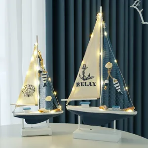 Ocean style wooden sailboat model decorative ornament with LED lights for home decor.
