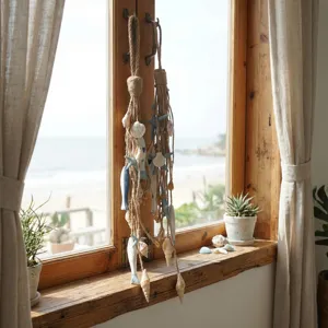 Decoration murale de style cotier en corde de chanvre, coquillage et etoile de mer pour interieur.