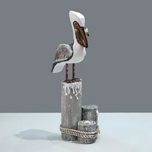 Handcrafted wooden pelican figurine Mediterranean style desk decor sculpture on wood piling