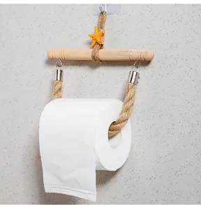 Wooden toilet paper holder detail with hemp rope and starfish decor for bathroom