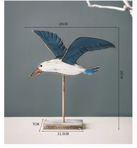 Detailed view of Mediterranean retro wooden seagull bird figurine home desk decor piece.