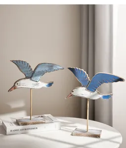 Coastal vintage wooden seagull figurine set, rustic marine bird decor for shelf home table.