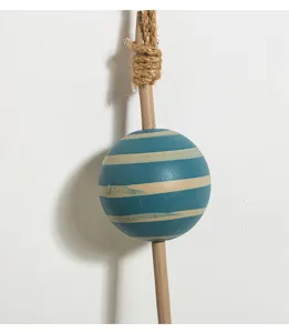Mediterranean solid wood buoy hanging ornament detail shot, coastal nautical wall decor.
