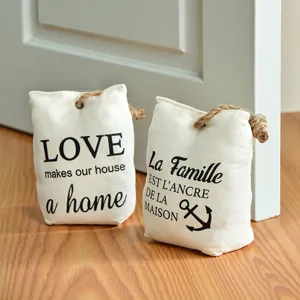 Canvas fabric door stop set with rope handle and decorative typography text for home decor.