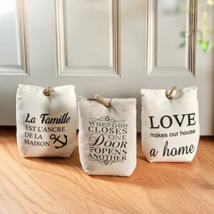 Decorative canvas fabric door stop set featuring inspirational typography for home use.