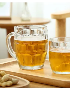 Detail view of the clear glass beer mug with textured pineapple pattern and sturdy handle.