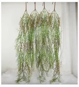 Artificial hanging plant vines detail view for wall decoration and green plant layout.