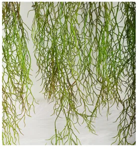 Artificial hanging green plant vine detail, realistic hanging foliage for wall decor and flower arrangements.