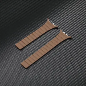 Brown magnetic leather watch strap detail, compatible with smart watch, premium replacement loop.