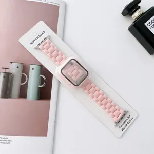Detailed view of pink silicone watch band and protective case set for smart watch, smooth texture.