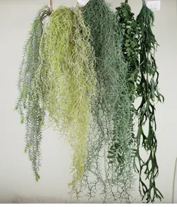 Artificial hanging plant detail, faux greenery vine wall decor, realistic leaf texture display.