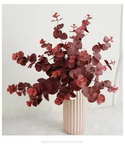 Artificial eucalyptus leaves detail shot, 3-prong faux plant for home decor and floral arrangement.