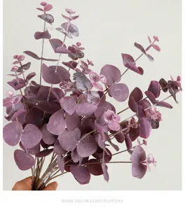 Detailed view of artificial eucalyptus leaf branch, purple money plant stem for home decor.