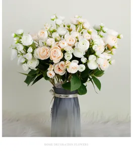 Artificial small tea rose flower bouquet with gradient glass vase for home decor.