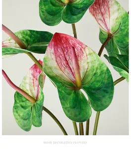 Artificial anthurium flower detail close up, realistic PU red green plant leaf photography prop.