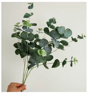 Artificial eucalyptus leaves stem detail view, 3-fork fake greenery branch for home decor.