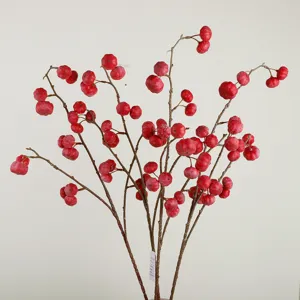 Artificial red pumpkin fruit branches for home decor, winter holiday table floral arrangement.