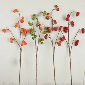 Artificial mini pumpkin berry branches autumn floral arrangement for home tabletop decor.