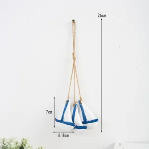 Mediterranean style wooden sailboat wall hanging pendant with natural jute rope decoration.
