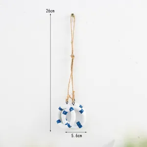 Detail shot of a Mediterranean style wooden lifebuoy hanging ornament with hemp rope.