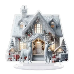 Gedetailleerde close-up van het acryl winter sneeuwhuis en rendier bureaublad vakantie ornament.