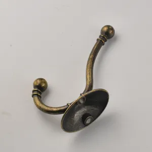 Close-up detail of the antique bronze coat hook, showing classic vintage texture and sturdy base.