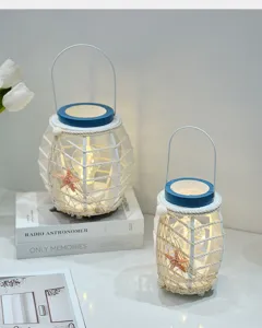 Mediterrane LED gloeiende lantaarn ornament met nautische zeester en touw voor kamerdecor.