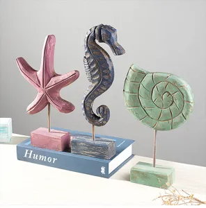 Mediterranean nautical wooden ornament set featuring starfish, seahorse, and seashell.