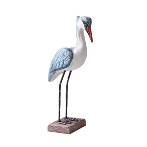 Handcrafted wooden bird figurine with metal legs coastal home decor tabletop accent ornament