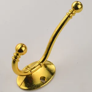 Gold finish wall hook coat hanger hardware detail view for home organization and decor use.