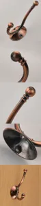 Vintage copper coat hook detail view showcasing retro design and screw mounting base.