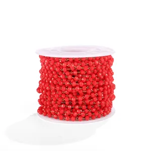 Red crystal glass chain detail view, DIY jewelry making accessory spool for bracelet necklace.