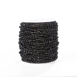 Black crystal bead chain detail, sparkling glass beads on spool for DIY jewelry accessories.