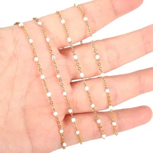 Stainless steel gold plated cross cable chain with white enamel beads for handmade DIY jewelry.