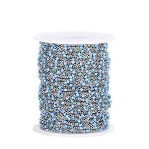 Close-up detail of stainless steel beaded chain featuring blue enamel beads for DIY crafts.