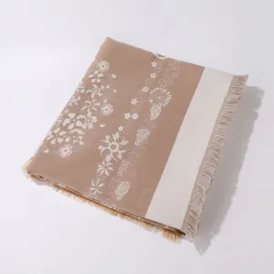 Women autumn winter warm knitted shawl scarf with floral pattern and tassels detail.