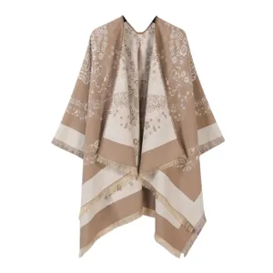 Detailed close-up of the elegant knitted floral pattern poncho fringe wrap cloak knitwear