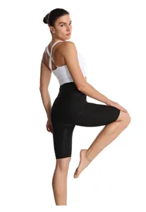 High-waist black coated sports shorts for women detail view showing fit and stretch.