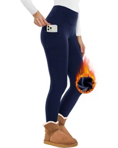 Leggings invernali termici a vita alta con pile interno e comode tasche blu scuro.