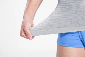 Men shaping waist trainer detail showing breathable elastic knit fabric for tummy control.
