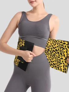 Leopard print waist trimmer belt detail, adjustable hook and loop closure for fitness and yoga.