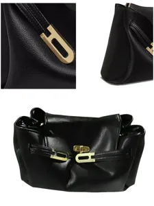 Sac à main classique en cuir noir avec fermeture métallique élégante pour femmes chic.