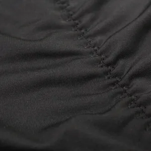 Men's high waist shapewear boxer briefs detail showing black stretchy fabric and lift seam.